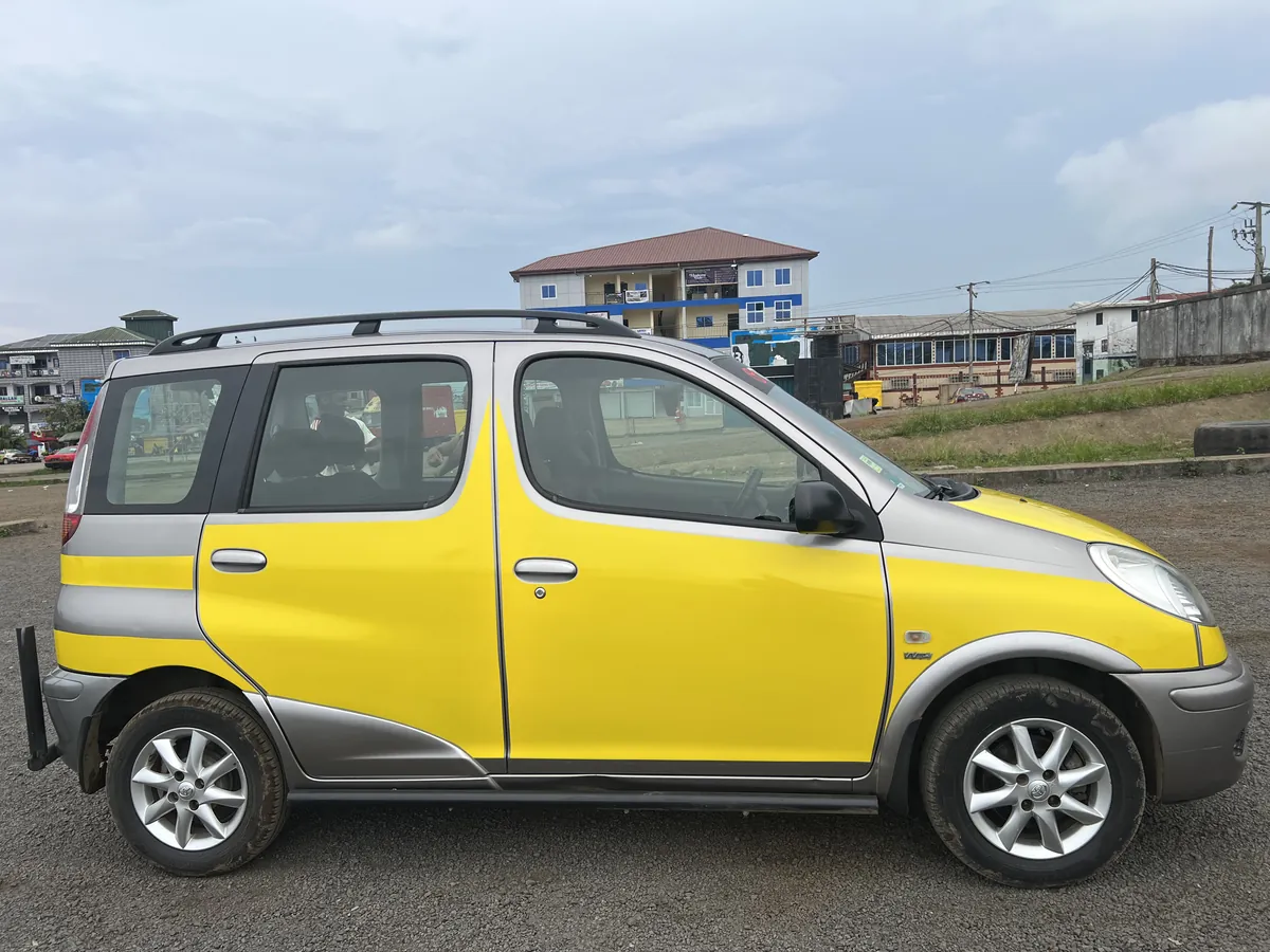 Stunna Mobility Toyota Yaris Verso right side profile parked in Buea