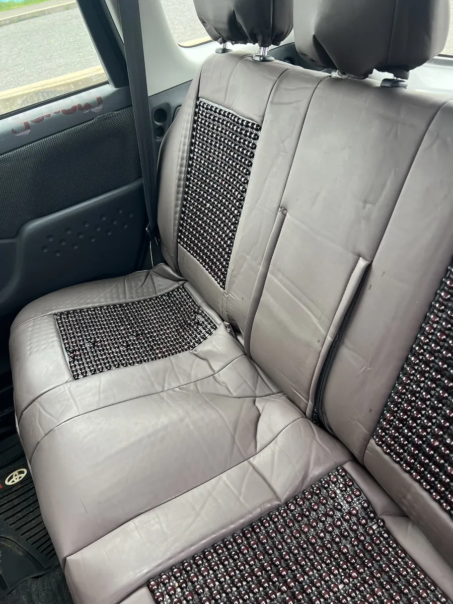Toyota Yaris Verso rear passenger seats with leather covers and bead cushions